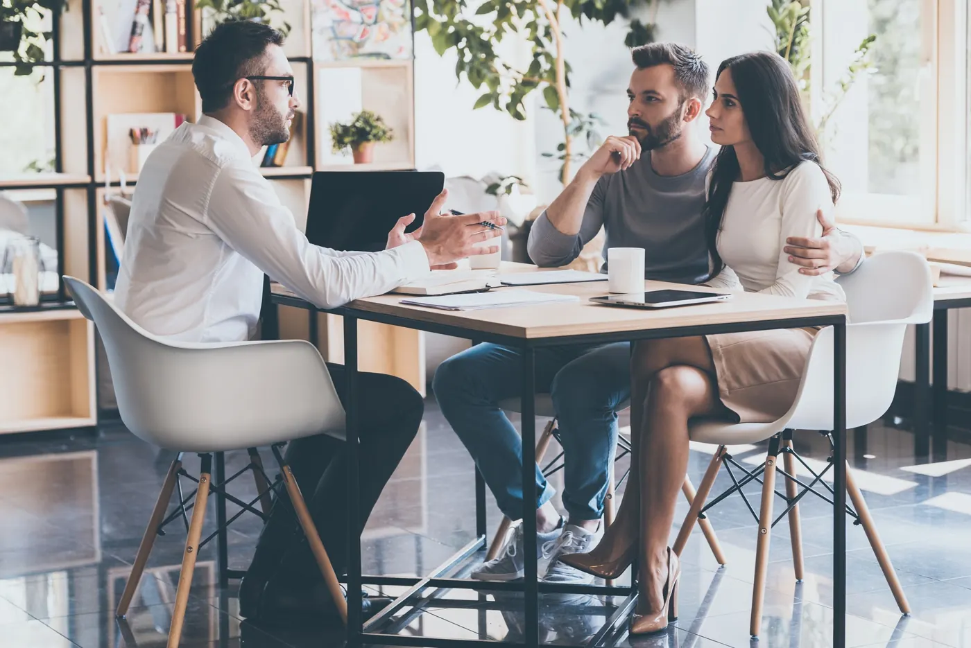 Advisors meeting with clients around a table